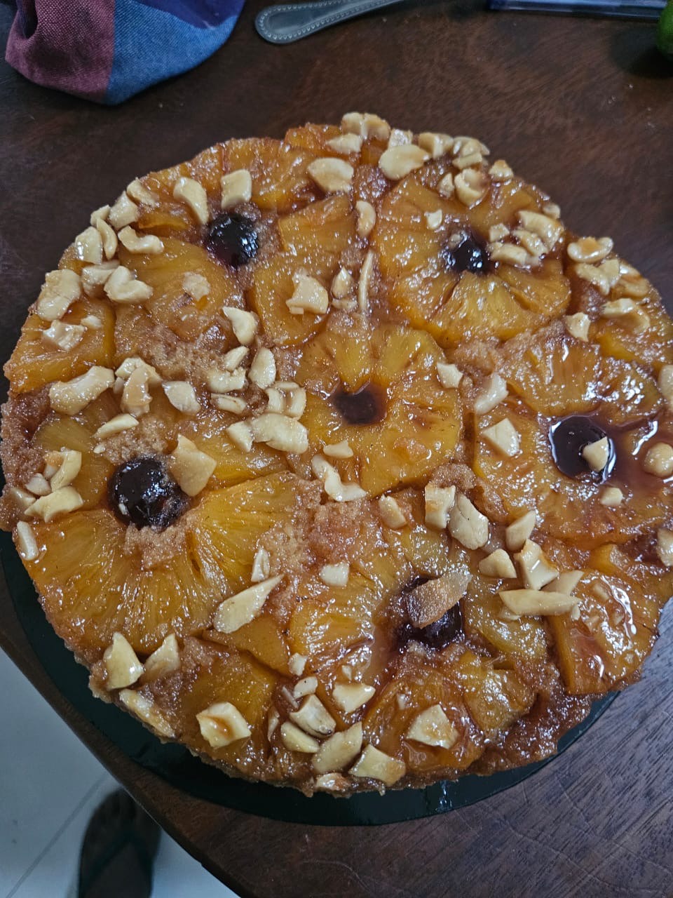 Pineapple upside-down celebration cake topped with cashews