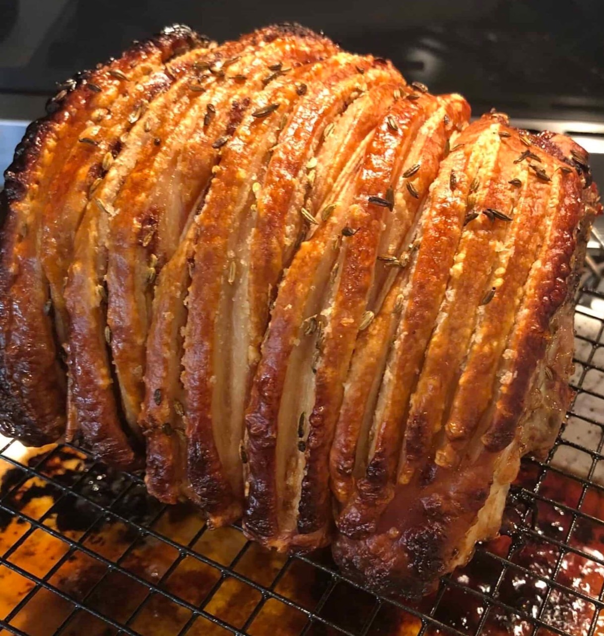 Crisp herb-roasted pork prepared for a catered table