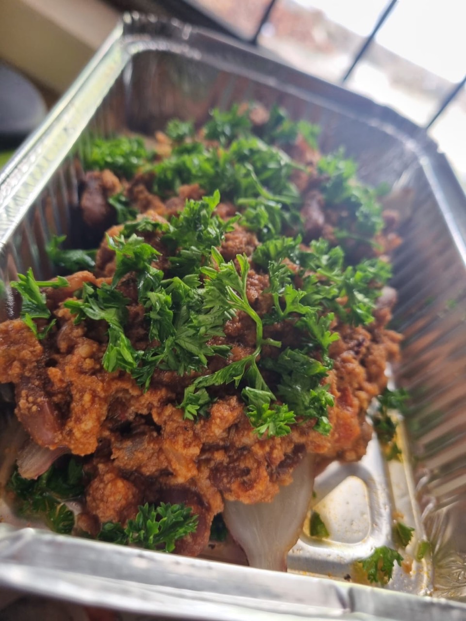 Crispy chicken topped with freshly chopped herbs